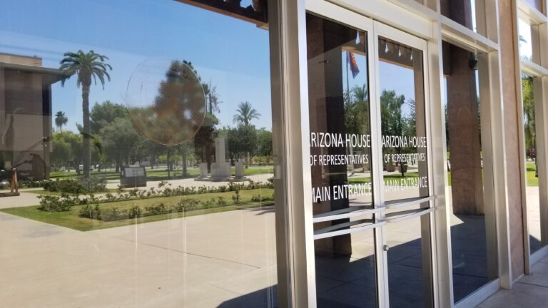Public building entrance with lettering on the glass doors
