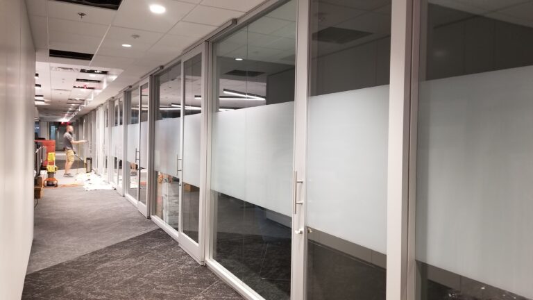 Frosted film band along a glass corridor