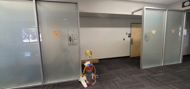 Frosted privacy film on restroom glass partitions