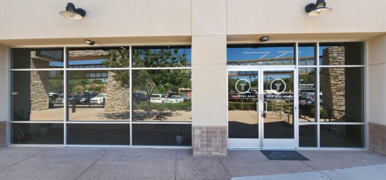 Storefront with tinted glass and door graphics