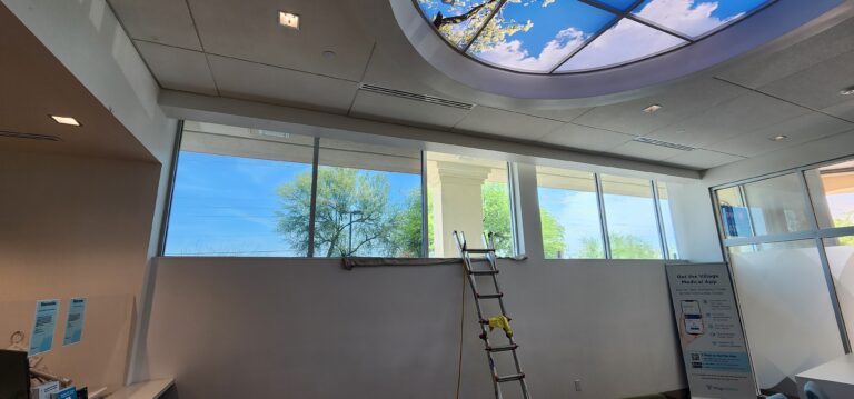 Office with window film and a skylight ceiling