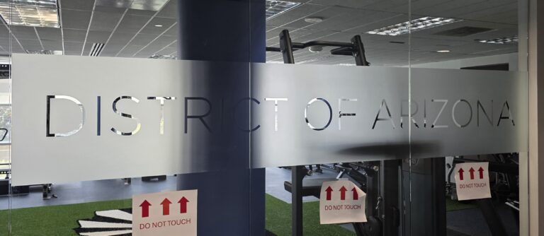 Frosted lettering on an interior glass wall