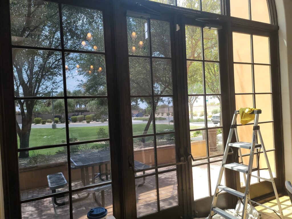 Arched French doors during a window film install