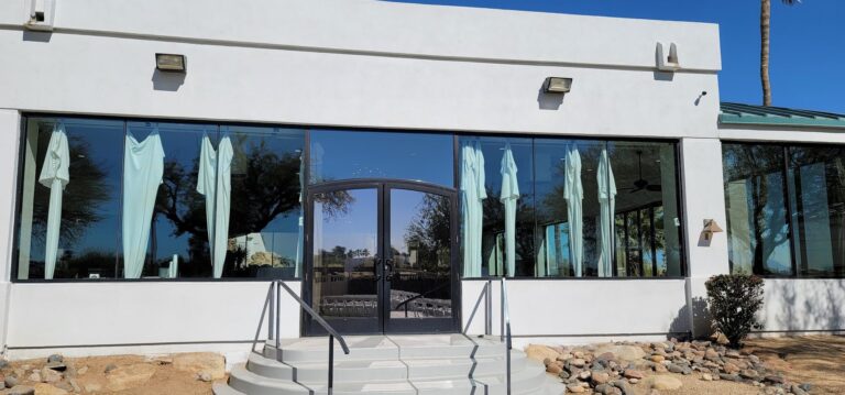 Commercial building entrance with tinted windows