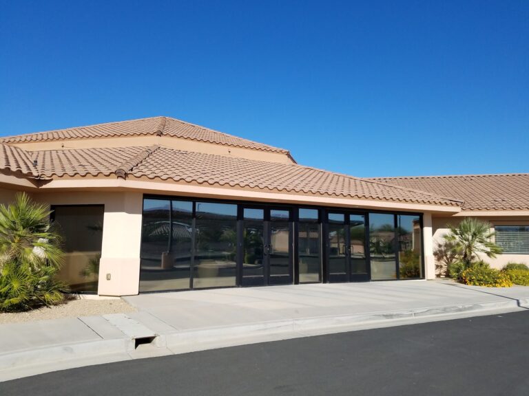 Single-story commercial office with tinted storefront windows