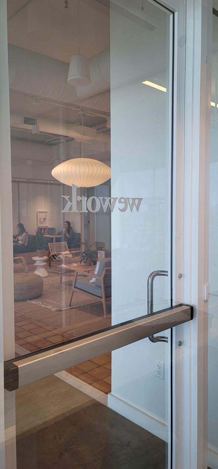Coworking office glass with a frosted logo