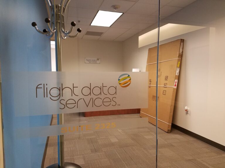 Office entry glass with a frosted company logo