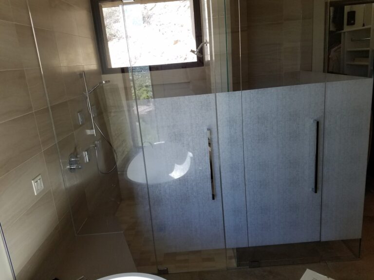 Shower glass with frosted privacy film