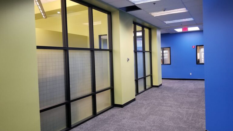 Office glass wall with grid-pattern privacy film