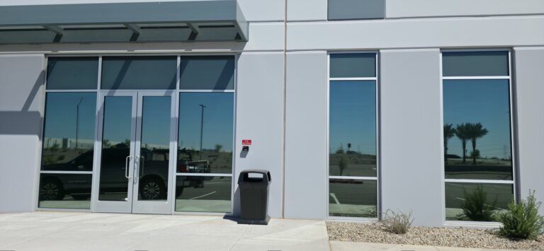 Industrial building storefront entry with tinted glass