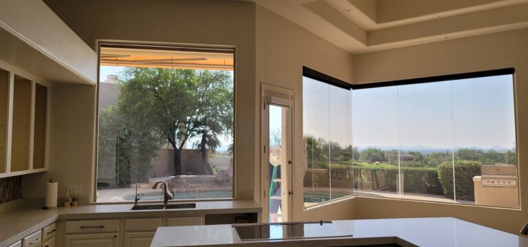 Kitchen corner windows with tint overlooking a golf course