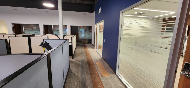 Office corridor with frosted line privacy film on a glass wall
