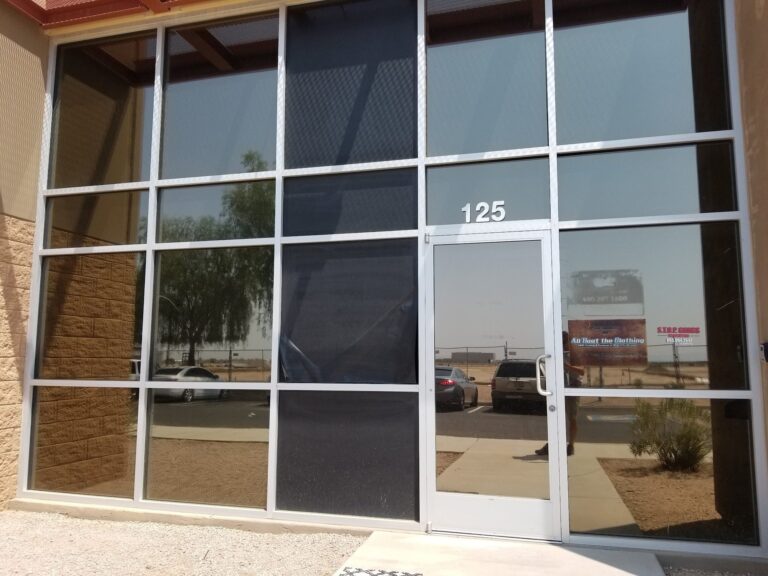 Commercial storefront with tinted glass and entry door