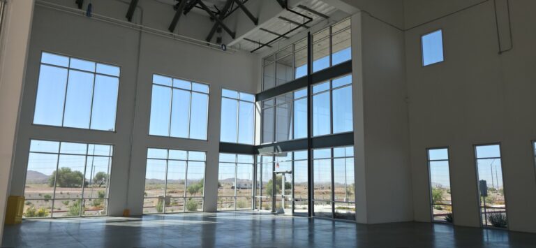 Warehouse interior with tall windows and window film