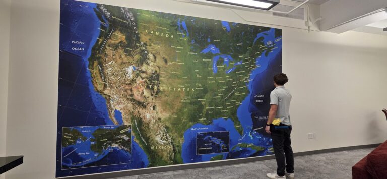 Large printed wall map graphic in an office